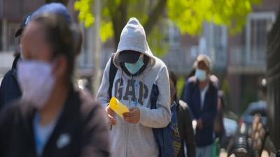 People wearing masks outdoors