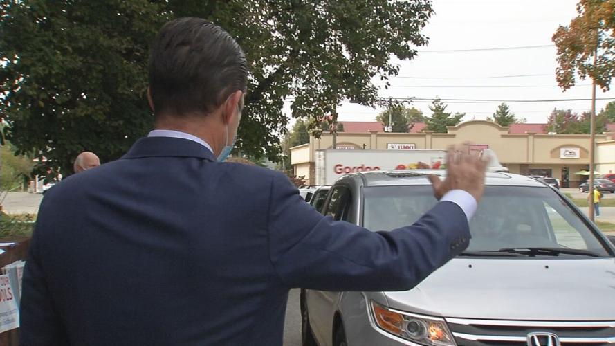 JCPS Superintendent Marty Pollio waves at a parent