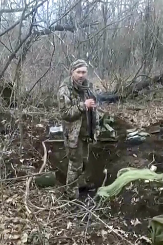 Ukrainian soldier smokes cigarette before being shot