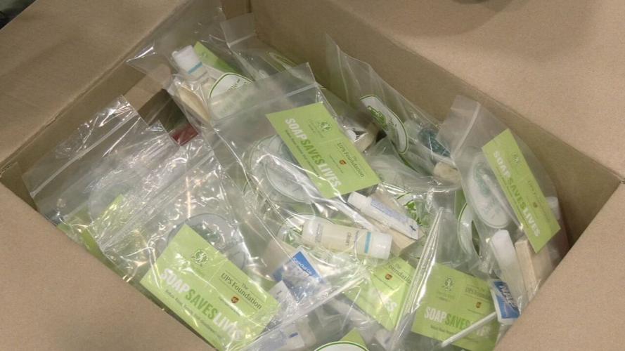 UPS employees packing hygiene kits for the homeless on April 19, 2022