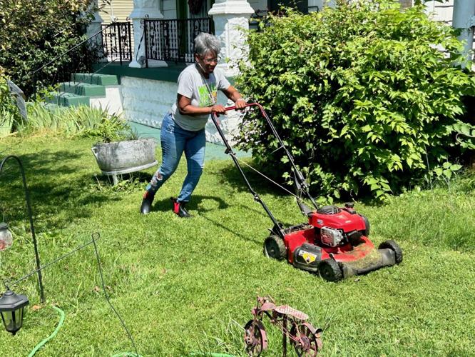 Woman Mowing