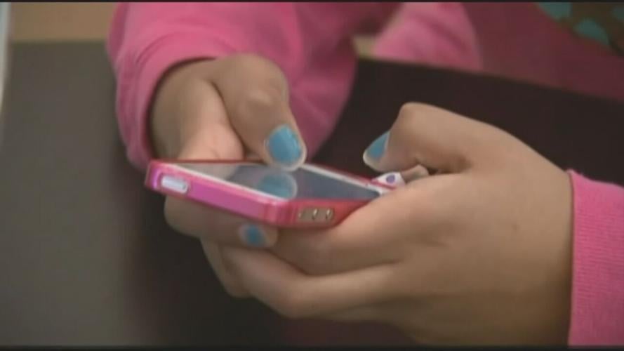 Teen on cellphone .jpeg