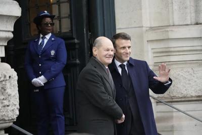 French President Emmanuel Macron welcomes German Chancellor Olaf Scholz - AP FILE.jpg