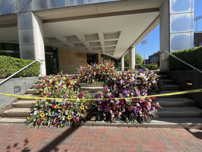 The community memorial outside Old National Bank continued to grow on Thursday, April 13, 2023.
