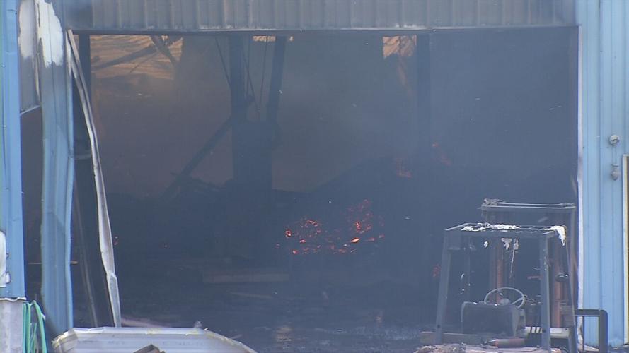 Aftermath of fire at Wholesale Hardwood Interiors in Campbellsville
