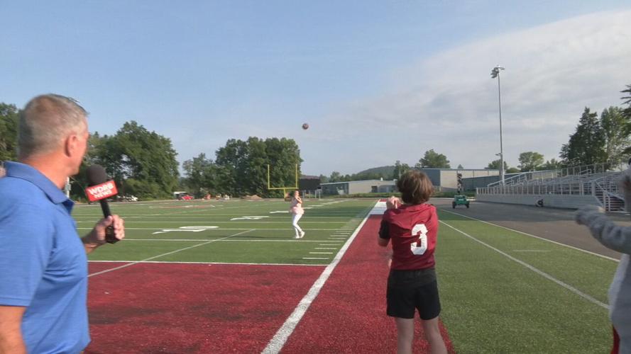 WDRB's Monica Harkins completes a pass at Bullitt Central High School