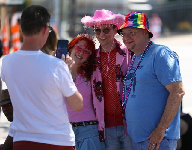 People pose for photo at Kentuckiana Pride Parade