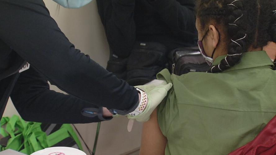 Teen getting Covid vaccine