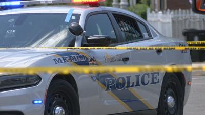 LOUISVILLE METRO POLICE - LMPD CRUISER - CRIME SCENE TAPE- DAYLIGHT 5-30-2024 1.jpeg