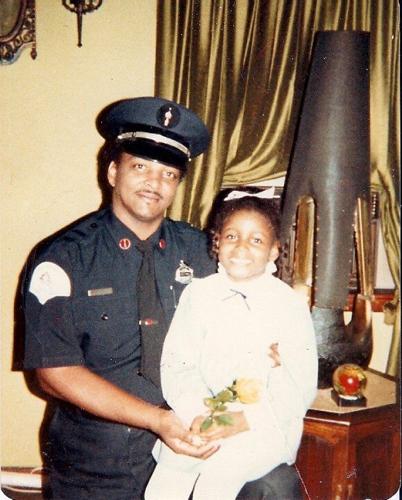 Firefighter Charles Adams with daughter