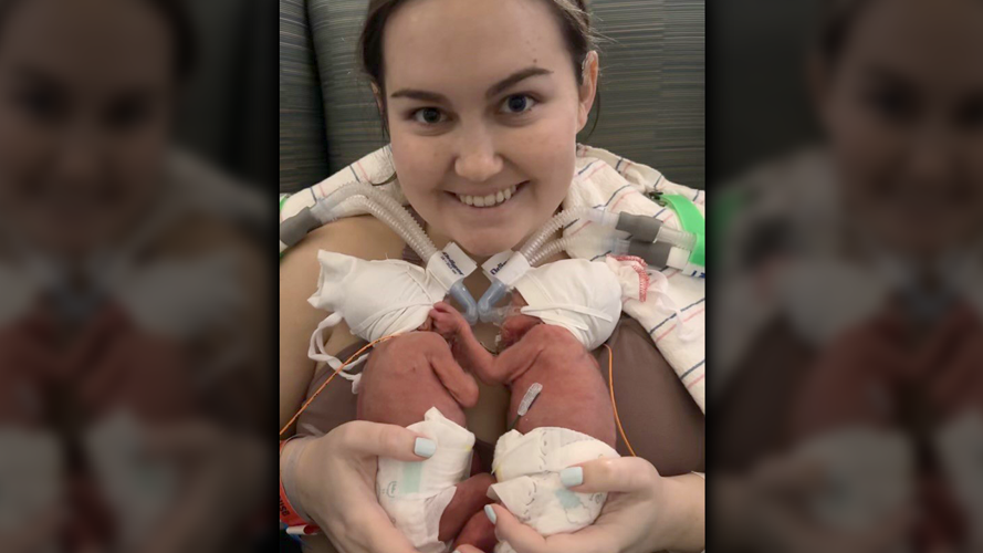 Jillian Myers smiles with her identical twin sons