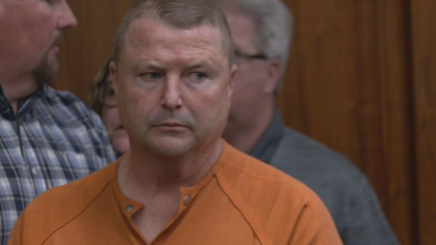Jamey Noel in orange jumpsuit