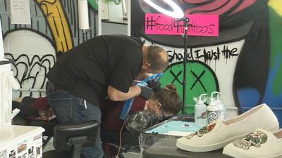 Southern Indiana food pantry and tattoo parlor team up to collect food in exchange for tattoos