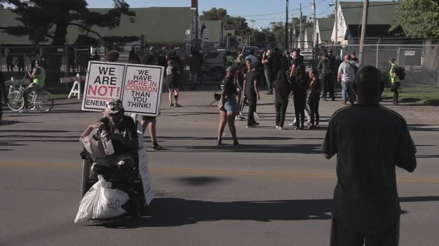 Man in wheelchair at Churchill Downs protest