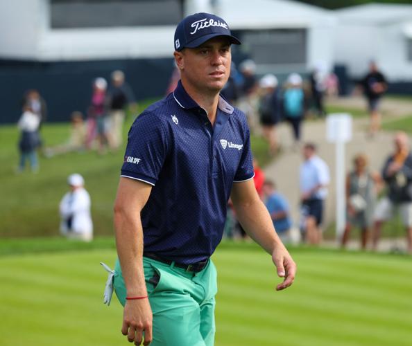 Justin Thomas walks up to 13th hole.JPG