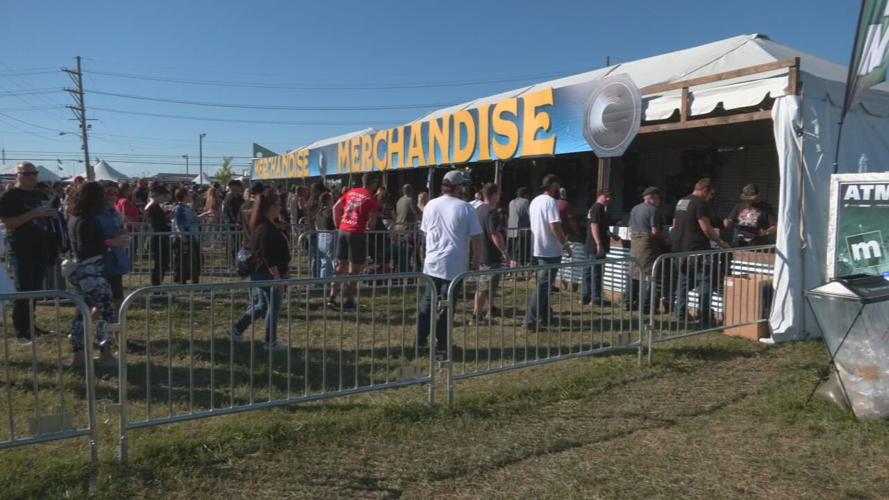 Louder Than Life fans near merchandise tents on first day of festival