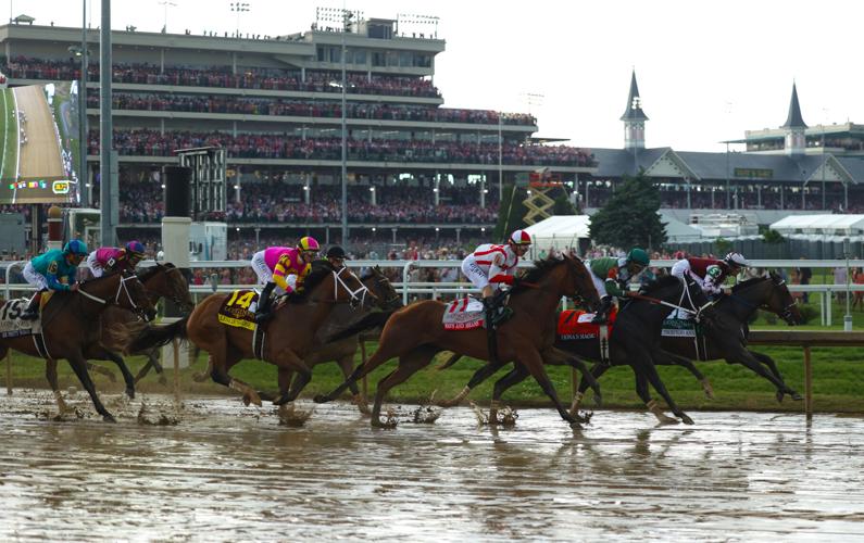 Kentucky Oaks race goes by First Turn.JPG
