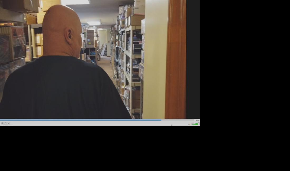 Curtis walks through halls of DVDs