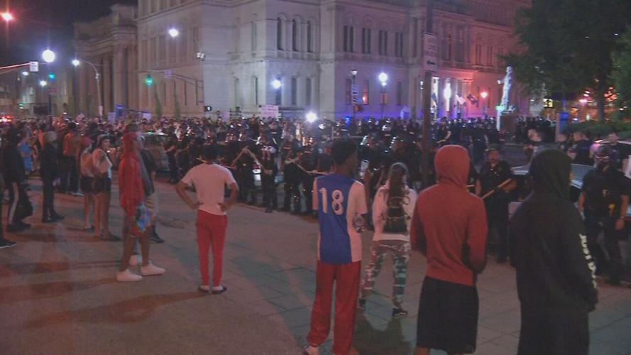Police and protesters confront each other