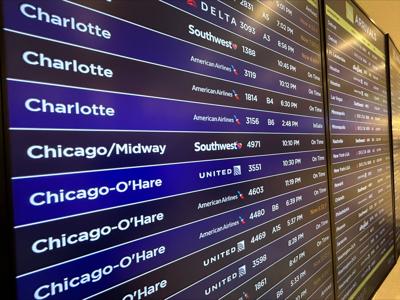 Flight board at Louisville airport winter storm preps 1-23-2026
