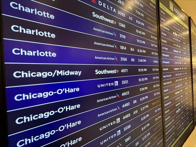 Flight board at Louisville airport winter storm preps 1-23-2026