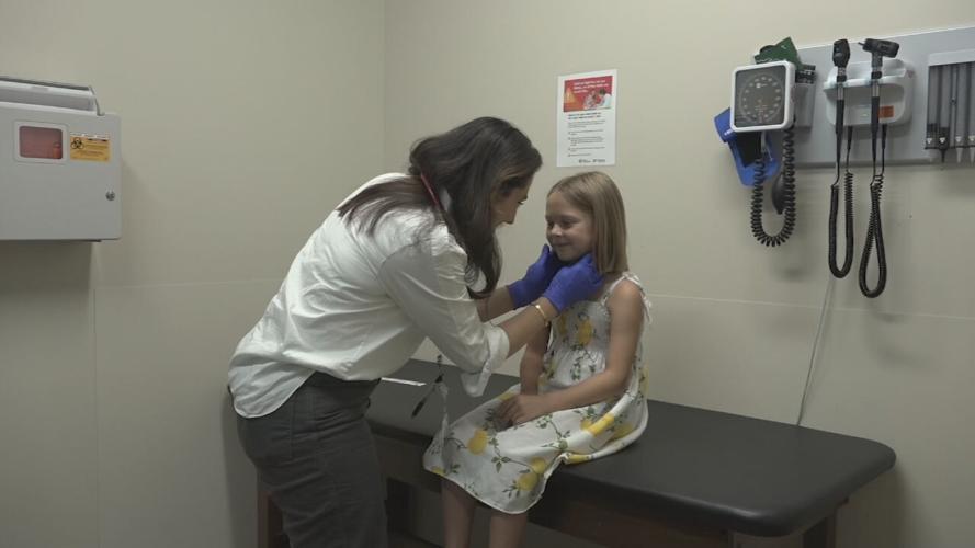 Child patient and doctor during child's annual physical