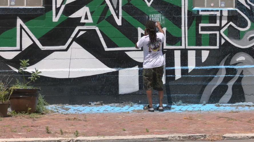 Braylyn Stewart-11th and West Main mural artist-Vandalism cleanup.jpeg