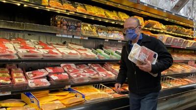 Man shops near meat case