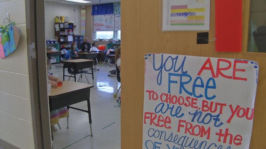 Students in a classroom wearing masks (generic)