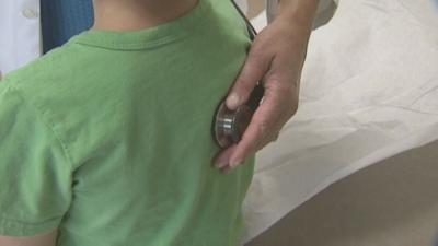 Child getting checked out by doctor (generic)