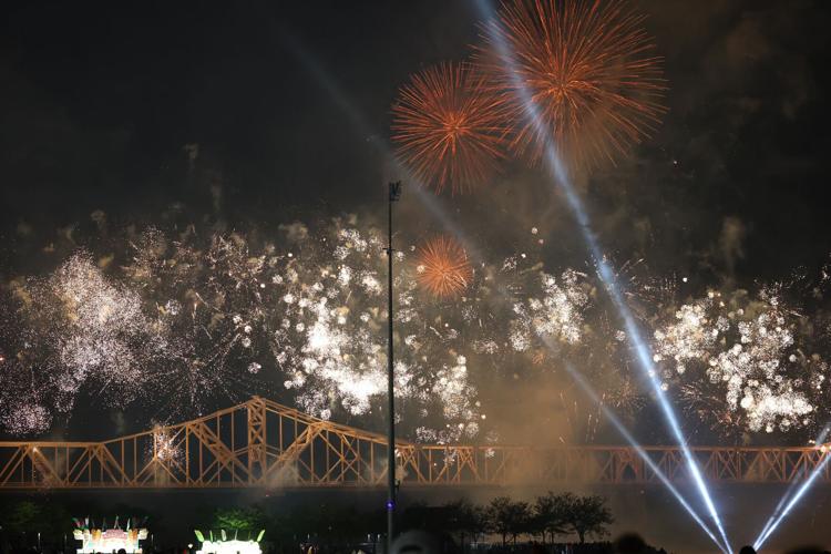 Fireworks explode near bridge.JPG