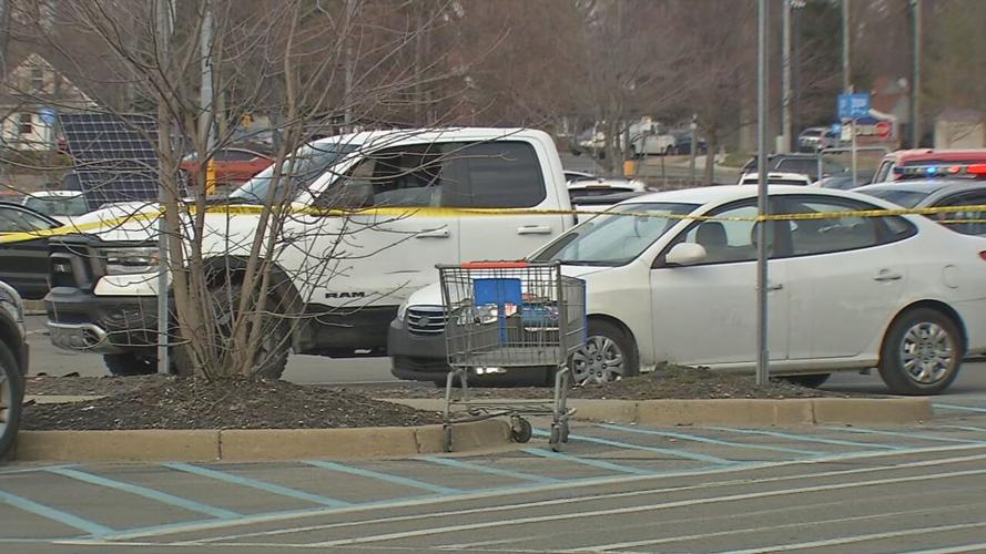 The truck that was involved in a police chase Tuesday, March 9, 2021, parked in the parking lot of a Walmart in Louisville, Ky.