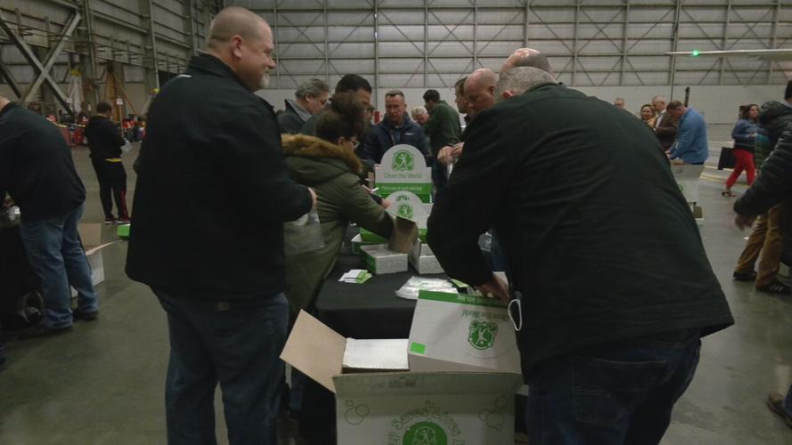 UPS employees packing hygiene kits for the homeless on April 19, 2022