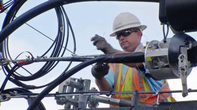 AT&T worker on pole