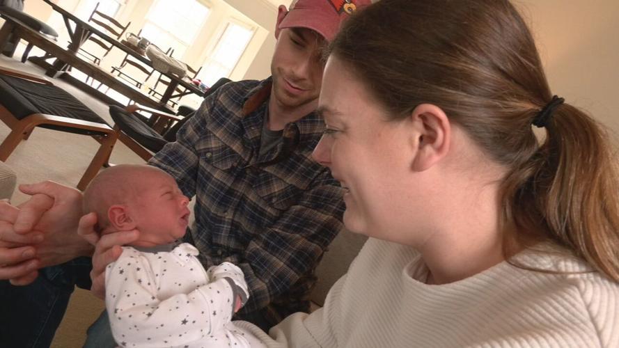 Carroll family holds baby Benjamin Gene
