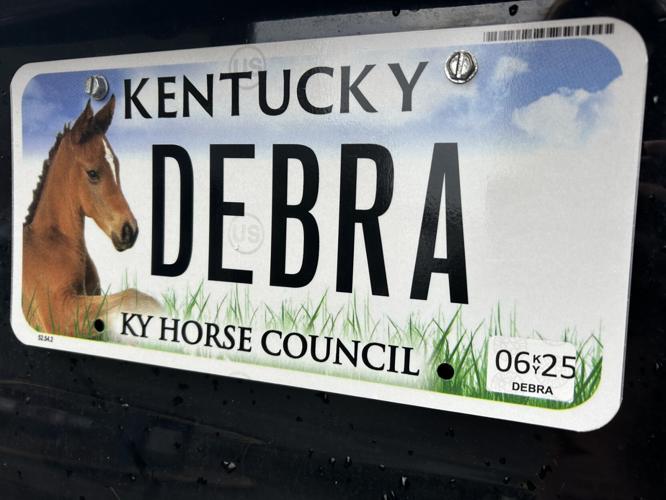 Debra Humphrey gets personalized license plate put on her new car Sept. 24, 2024