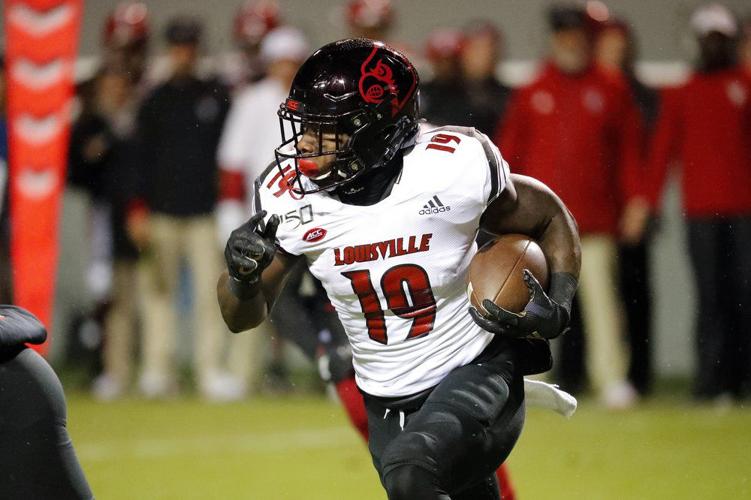Louisville's Hassan Hall (19) runs the ball