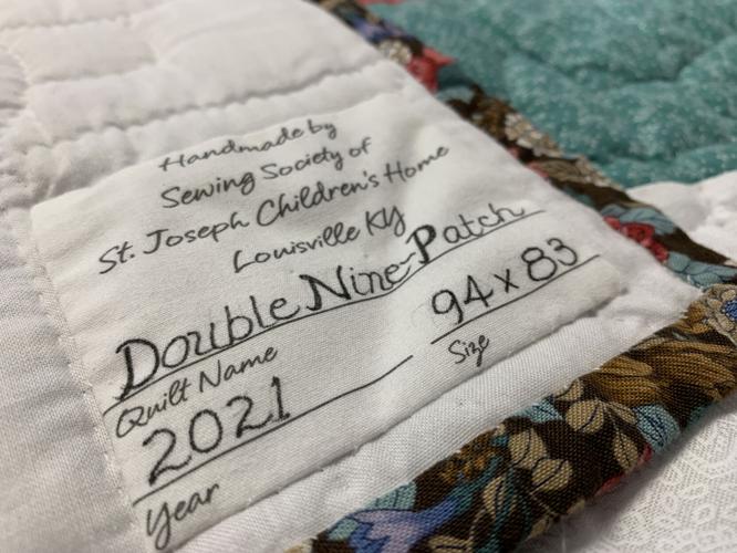 St. Joseph Children's Home quilts stitched with St. Joseph Ladies Sewing Society logo