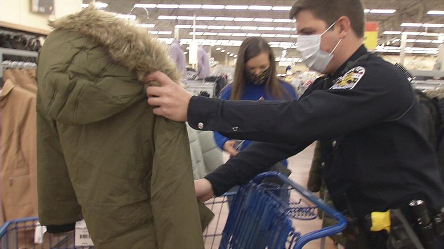 LMPD officer buys coat during shop with a cop