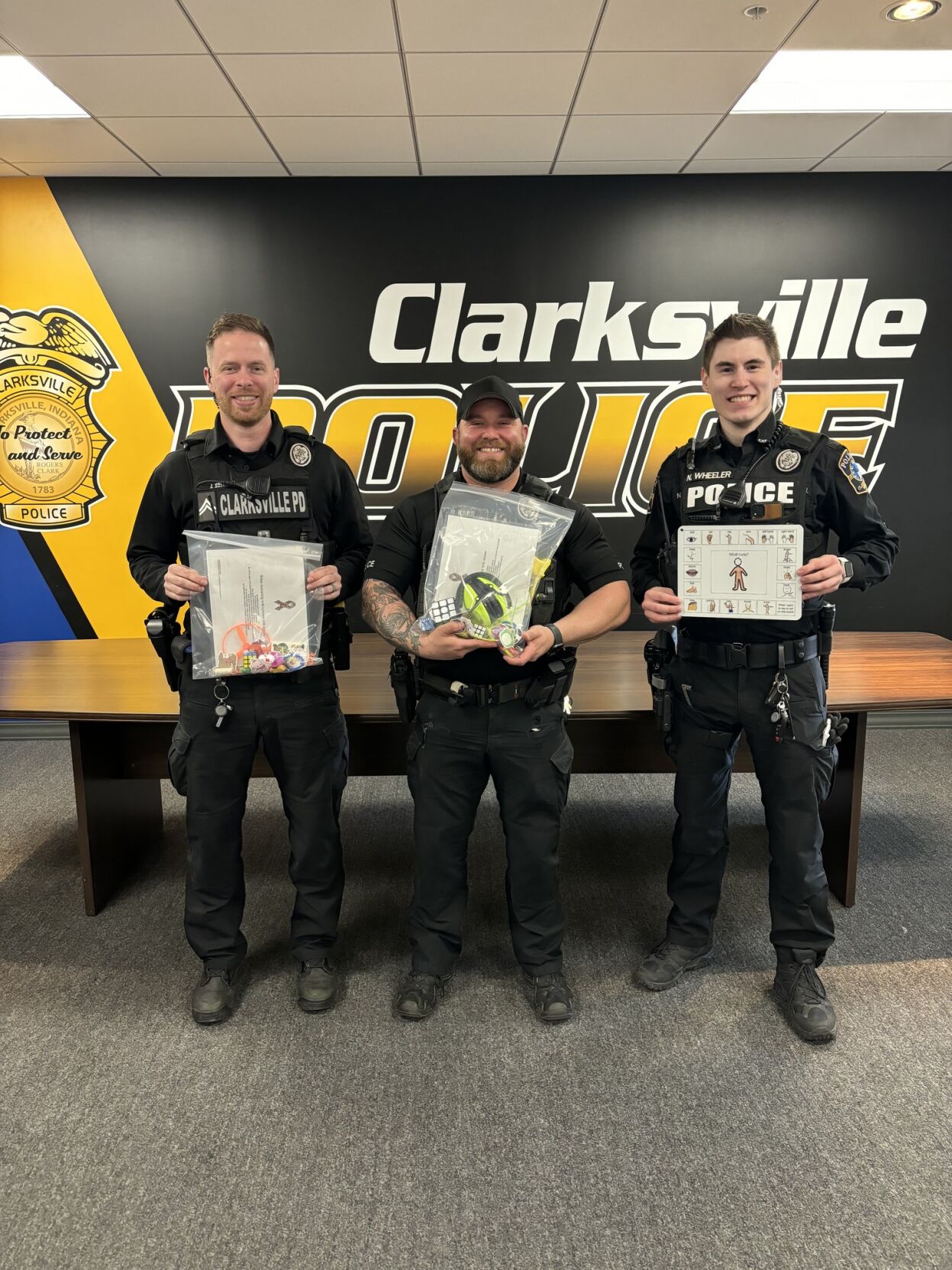 Clarksville Police Department poses for photo with sensory toys