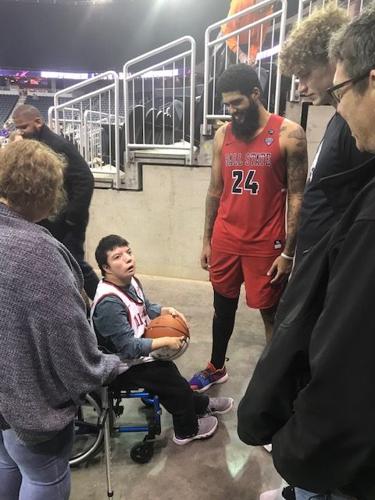 Trey Moses and a fan after a game