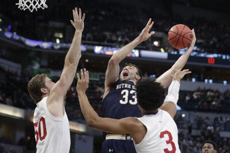 Notre Dame's John Mooney (33) shoots over Indiana's Joey Brunk
