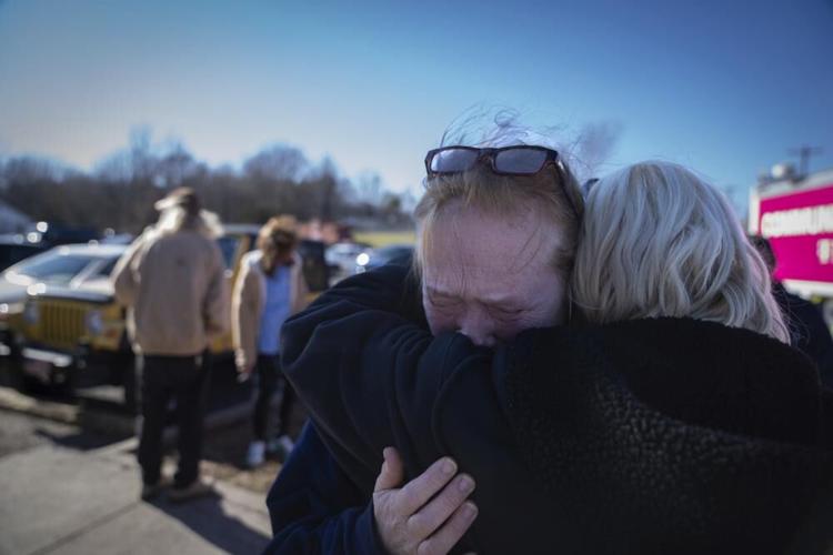 Tamara Yekinni hugs a friend outside a shelter in Wingo, Ky.jpeg