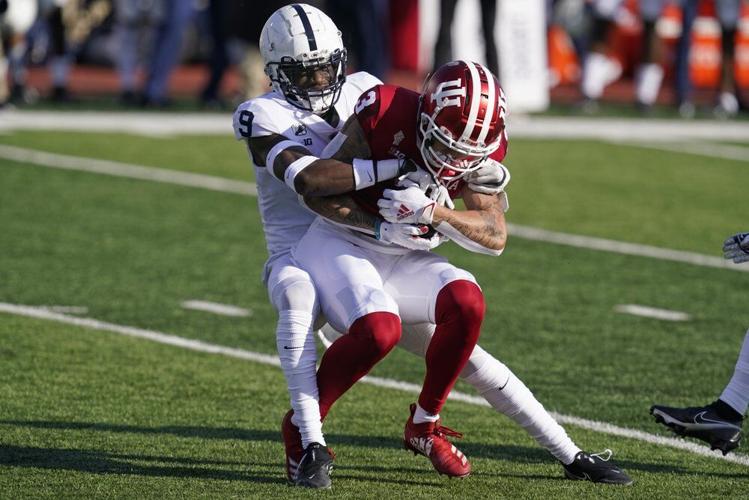 Indiana's Ty Fryfogle (3) is tackled by Penn State's Joey Porter Jr.