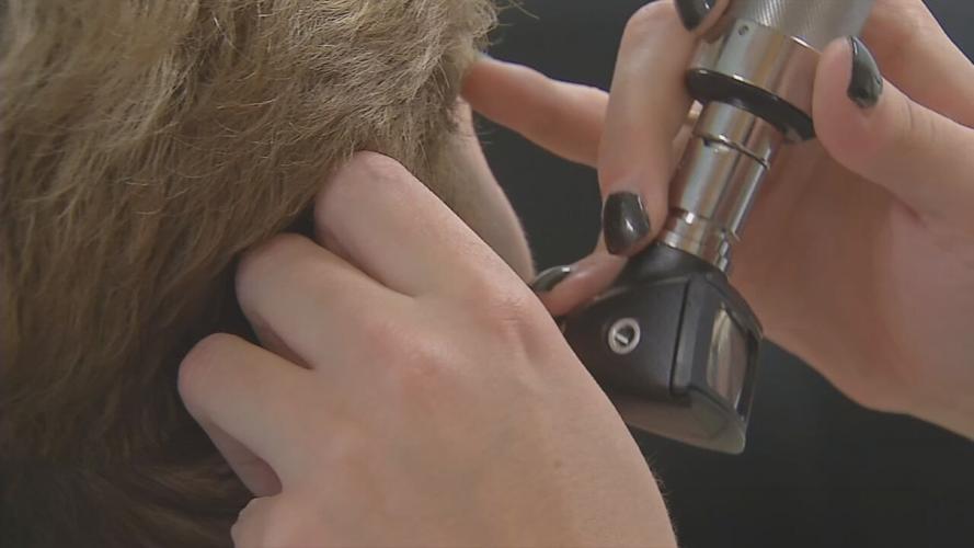 Generic-Person getting ear exam.jpeg