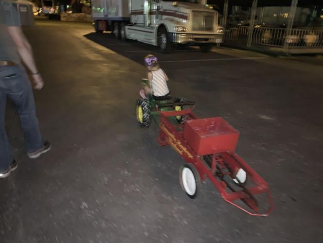 Lanesville Festival Child rides red tractor