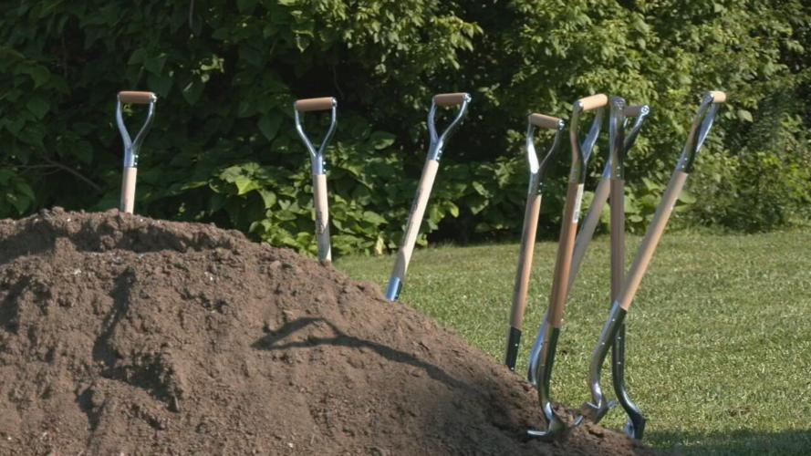 Shovels in dirt at Portshaw Apartments groundbreaking in Louisville's Shawnee neighborhood