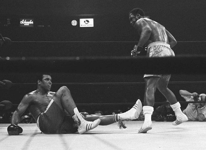 Frazier stands over Ali