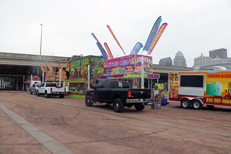 Crews set up booths along the Ohio River one day before Thunder Over Louisville 2023