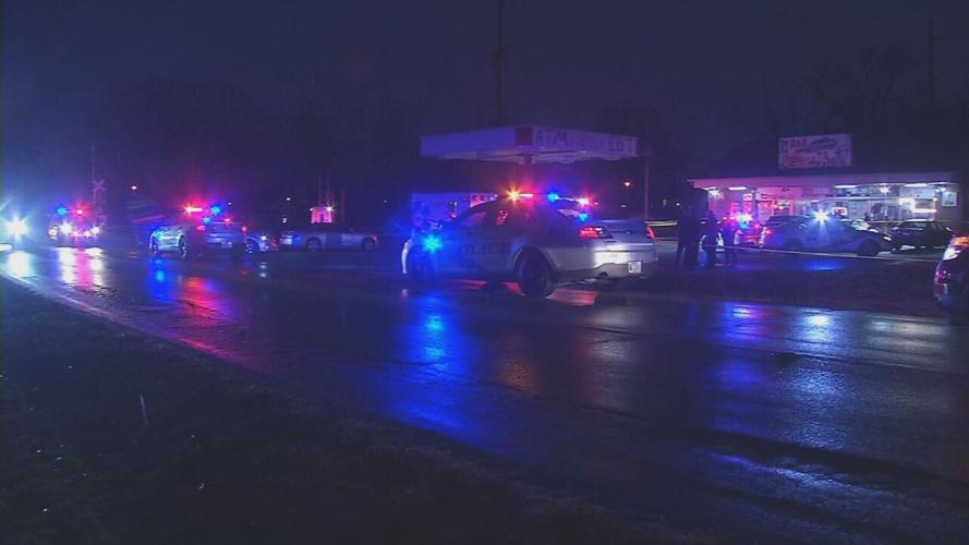 Louisville Metro Police respond to the scene of a double homicide